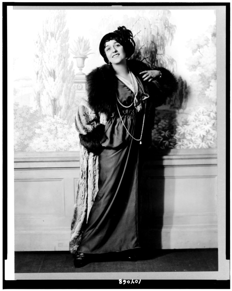 Lina Cavalieri, full-length portrait, standing, facing front wearing gown and long beaded necklace LCCN91787278