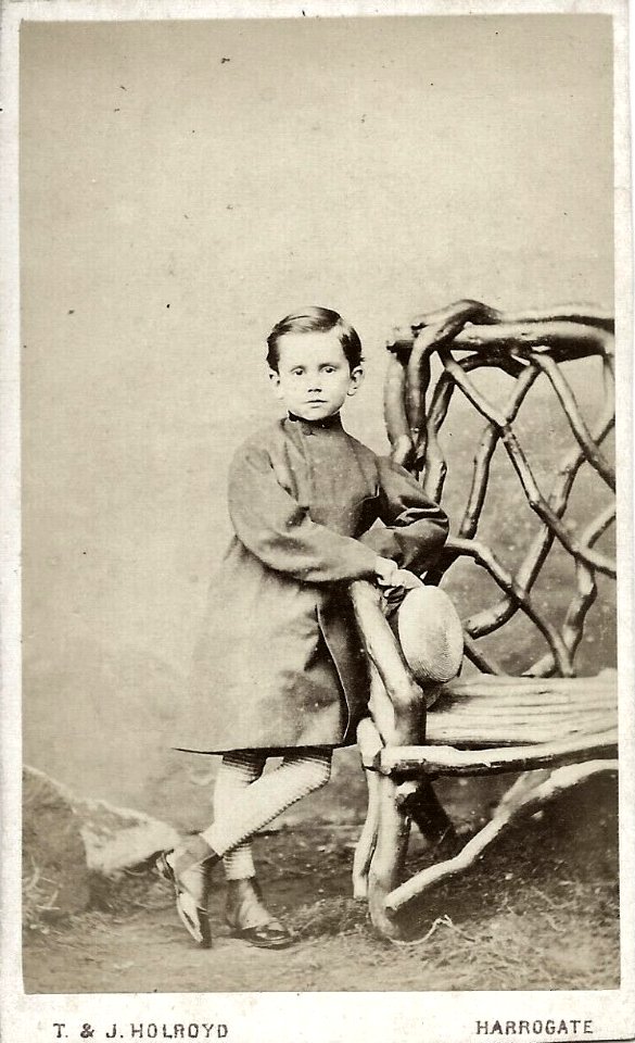Little boy with hat by T & J Holroyd