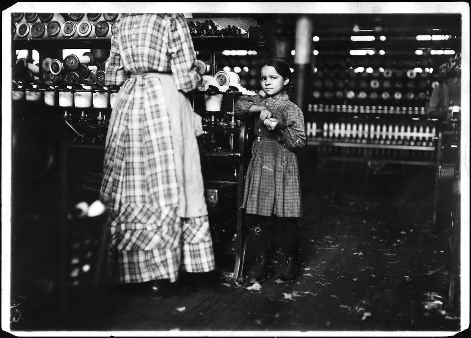 Little Fannie, 7 years old, 48 inches high, helps sister in Elk Cotton Mill. Her sister said, Yes she helps me right... - NARA - 523345