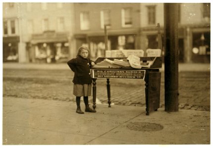 Little girl, apparently 6 yrs. old - but didn't know her name or age - tending stand at Washington and 3rd St. for older sister (-3234). Saloon on corner. 3 P.M. LOC nclc.03824