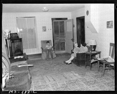 Living room in home of Monroe Bearnson, miner, who lives in company housing project. United States Fuel Company, King... - NARA - 540534 photo
