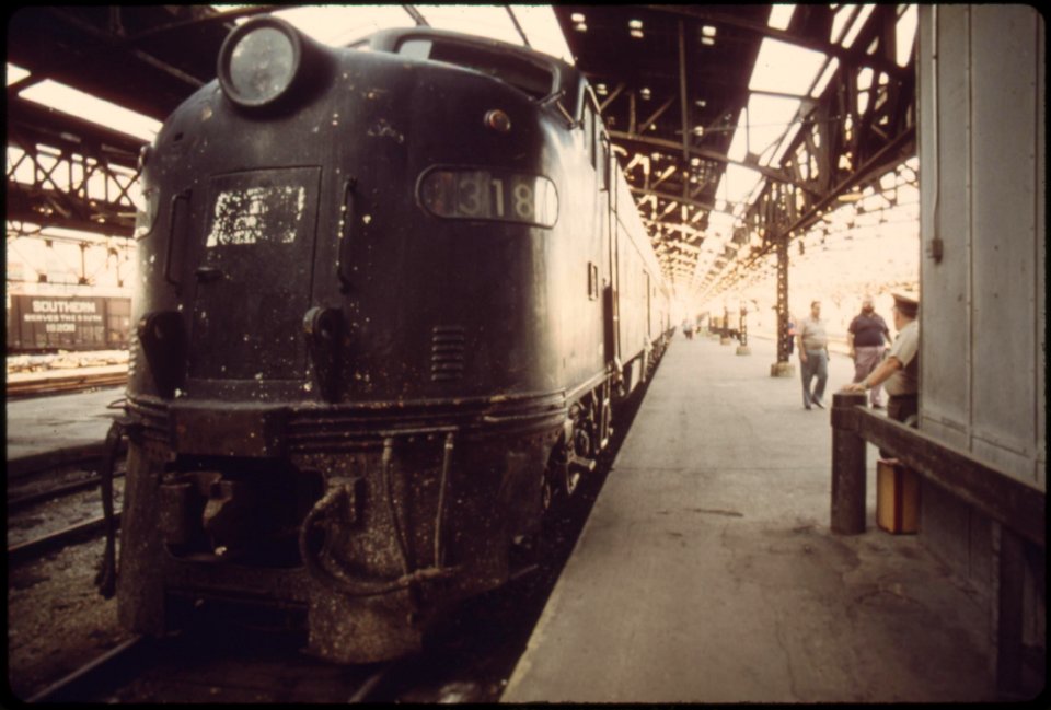 Loading-platform-at-union-station-in-kansas-city-missouri-the-old-engine-pulled-a-train-from-new-york-which-will-connect-with-the-southwest-limited-which-runs-between-chicago-and-los-angeles-june-1974 7158256338 o