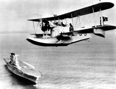 Loening OL flying over USS Lexington (CV-2) c1930