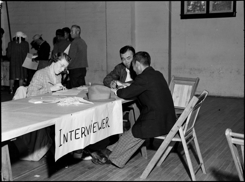 Lodi, California. Father and son give pre-evacuation information at wartime Civil Control Administr . . . - NARA - 537631