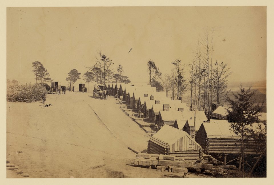 Log cabin barracks at a military facility LCCN2006683263