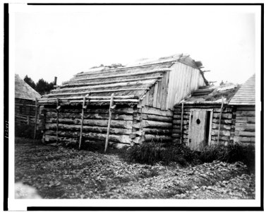 Log cabins or barabara, Kodiak, Alaska) - Curtis LCCN91706561