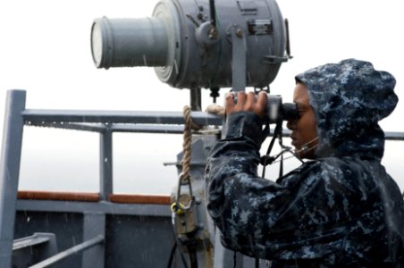 Logistics specialist standing watch aboard USS Porter (DDG-78) during arrival in Gaeta 160715-N-FQ994-045