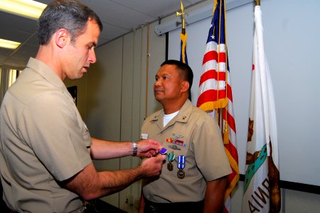 Logistics Specialist 1st Class Gerardo Dacasin receives a Purple Heart. (8552911058)