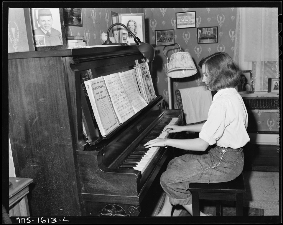 Lois, daughter of B. H. Barksdale, section foreman in the mines, playing the piano. U.S. Coal and Coke Company, Gary... - NARA - 540879