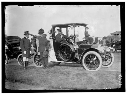 LONGWORTH, MRS. NICHOLAS. SITTING IN DOOR OF AUTO; WITH MRS. TAFT LCCN2016863787