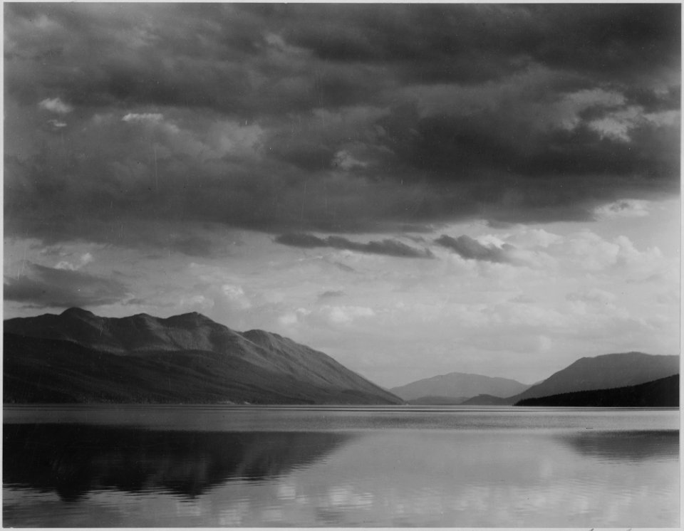 Looking across lake to mountains and clouds, Evening, McDonald Lake, Glacier National Park, Montana., 1933 - 1942 - NARA - 519870