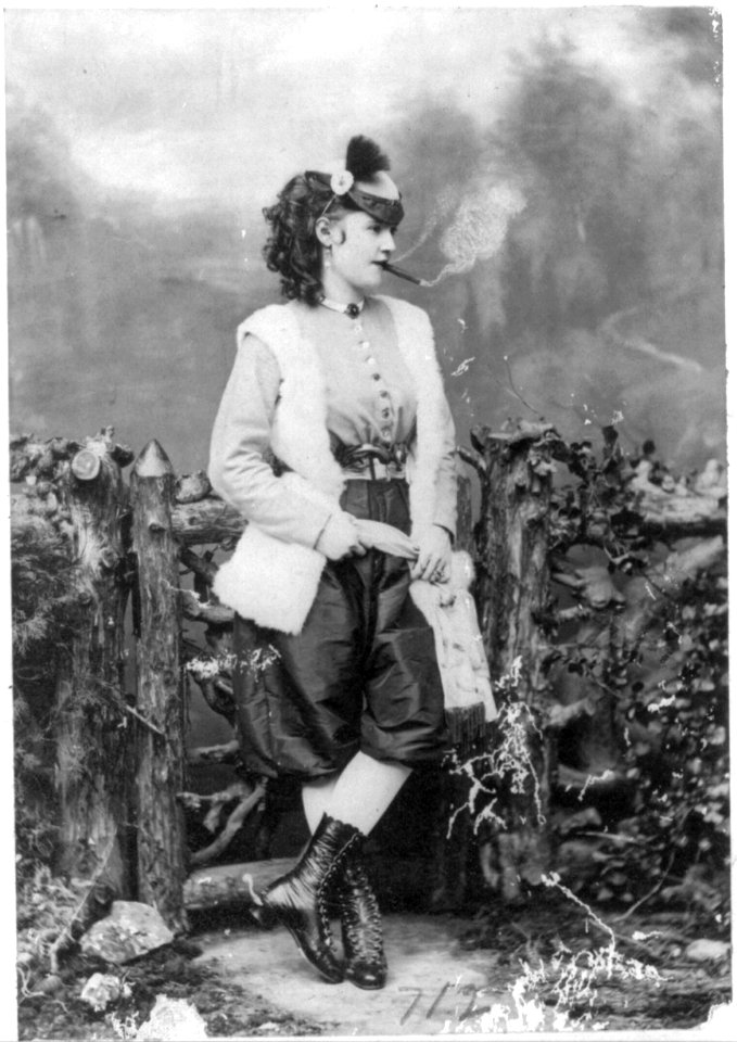 Lotta Crabtree, full-length portrait, facing right, smoking cigar LCCN2005690001