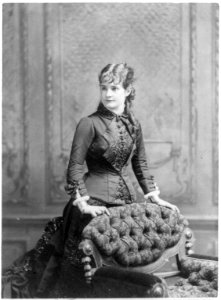 Lotta Crabtree, three-quarter length portrait, facing left, behind chair LCCN2005690000