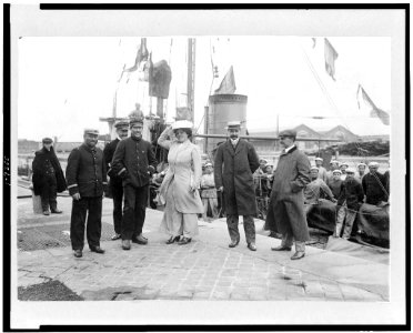 Louis Blériot with his wife on return to Calais, France, with ship behind them LCCN93504066