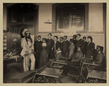 Louis Firetail (Sioux, Crow Creek), wearing tribal clothing, in American history class, Hampton Institute, Hampton, Virginia LCCN98502982