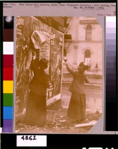Louise Hall, with brush, and Susan Fitzgerald pasting billboard posters, Cincinnati, May 1912 LCCN96515770