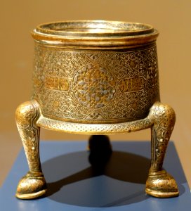 Lower body of an incense burner, Iran, 13th century AD, brass with silver and gold inlay - Aga Khan Museum - Toronto, Canada - DSC06609 photo