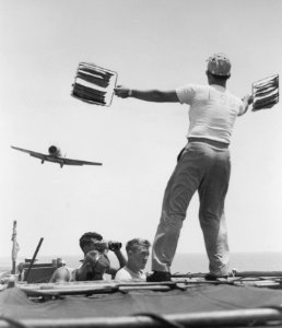 LSO guiding SNJ aboard USS Monterey (CVL-26) 1953