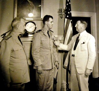 LT Draper L. Kauffman, USNR, is presented the Navy Cross by Frank Knox 1942 (23177619235)