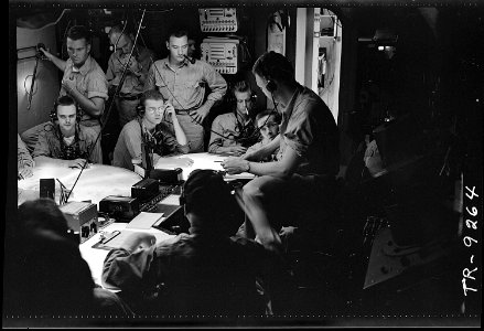 Lt. Cdr. A.F. Fleming, fighter director, in plot room of USS Lexington (CV-16) during a strike in the Gilbert & Marshall Islands - NARA - 520799
