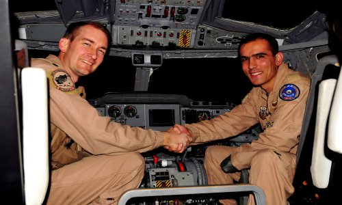 Lt. Col. Paul Bedesem, United States Air Force, 538th Air Expeditionary Advisory Squadron, Combined Air Power Transition Force, shakes the hand of Lt. Faiz Ramaki, Afghan National Air Corps (4382723718)