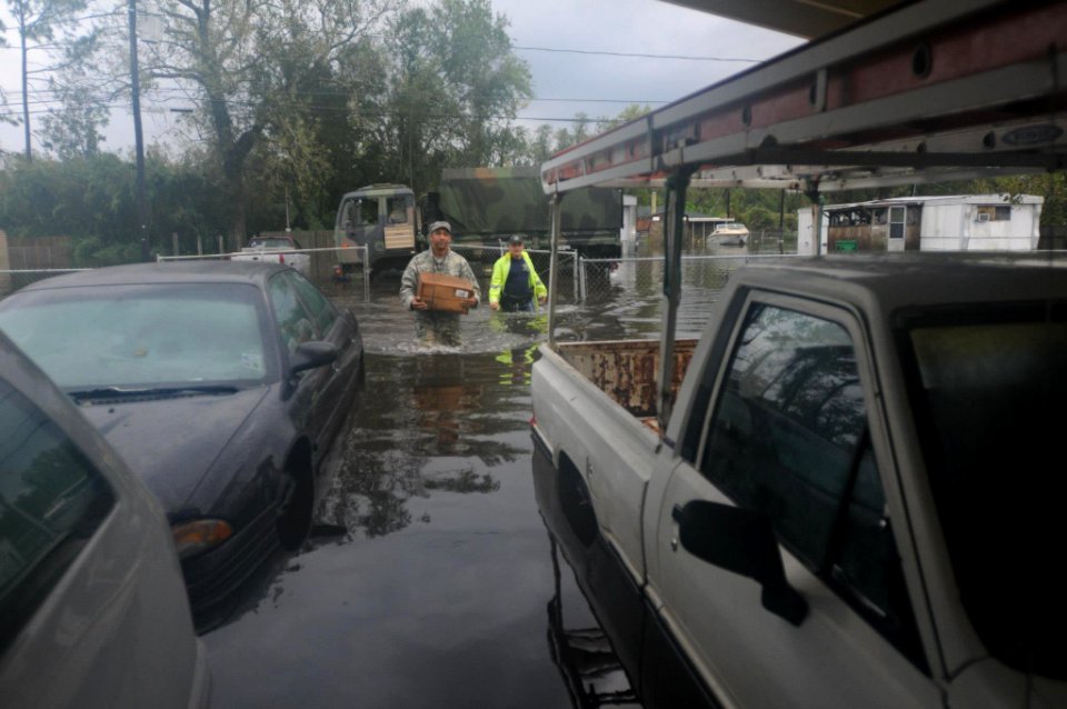 Louisiana National Guard bring MREs to flooded LaPlace Louisiana after Hurricane Isaac, 30 August 2012