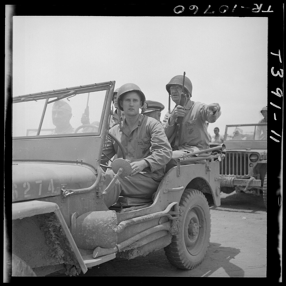 Lt. Gen. Holland M. Smith (right) USMC takes jeep tour of Saipan airfield. - NARA - 520968