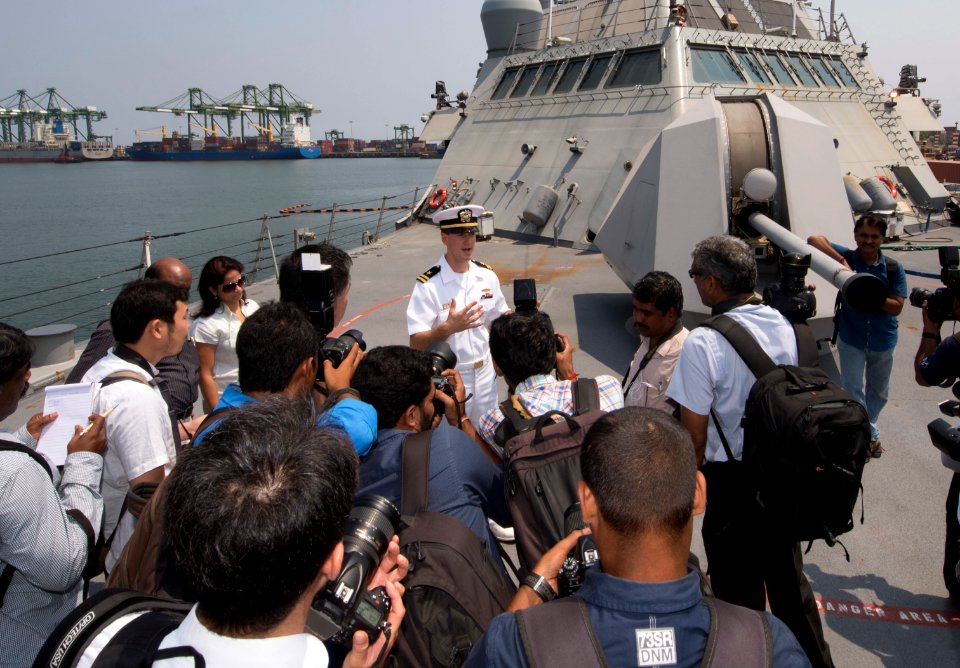 Lt. James Arterberry guides a tour for local media on the forecastle of USS Fort Worth