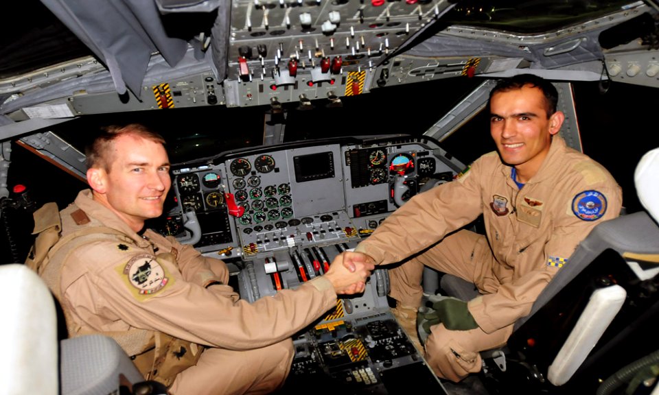Lt. Col. Paul Bedesem, United States Air Force, 538th Air Expeditionary Advisory Squadron, Combined Air Power Transition Force, shakes the hand of Lt. Faiz Ramaki, Afghan National Air Corps (4382723236)