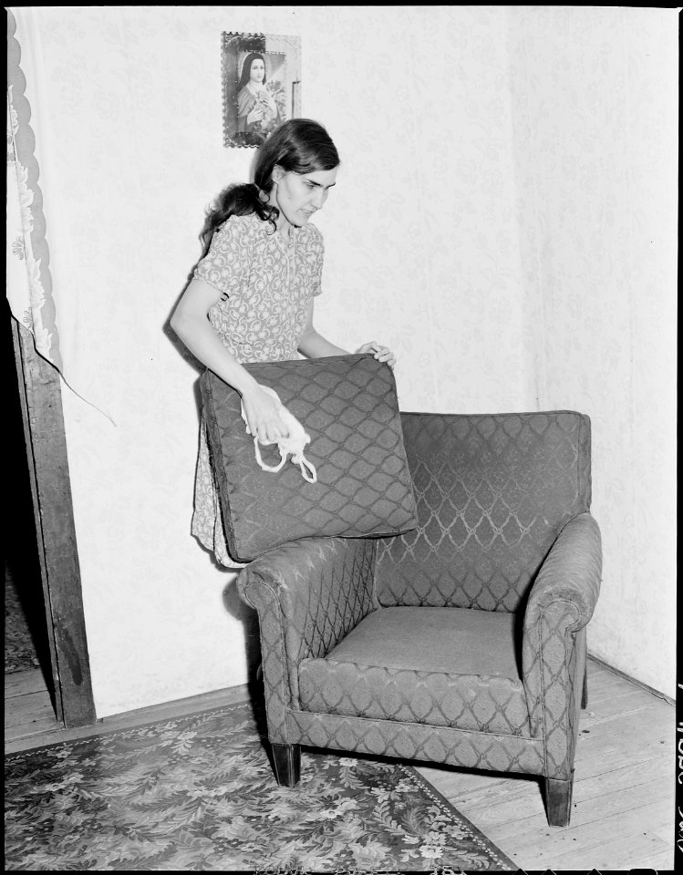 Lucy Sergent dusting. Although she has been totally blind since birth she is exceedingly adept at household tasks... - NARA - 541374