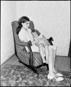 Lucy Sergent, who is blind, rocks her sister Bobbie Jean to sleep. Great devotion and family feeling among the... - NARA - 541369