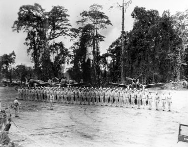 LtCdr. John Blackburn, USN, of VF-17 receives the distinguished flying cross, circa in February 1944 (80-G-255883)