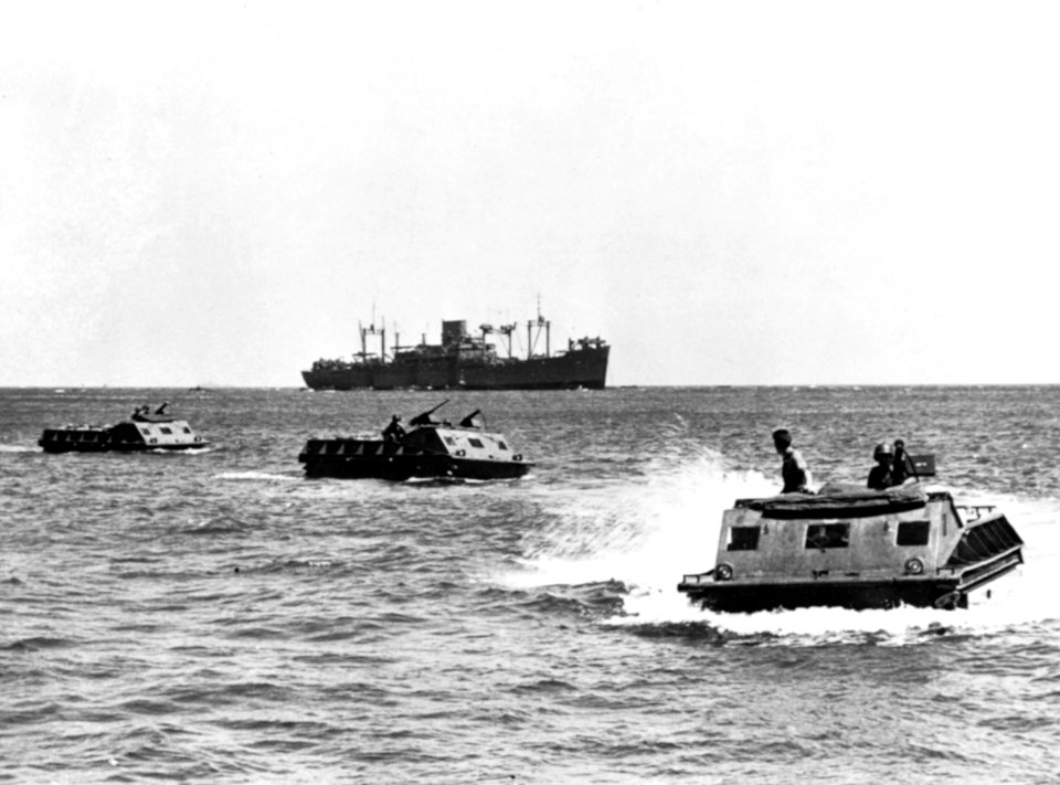 LVT amphibian tractors move toward the beach on Guadalcanal in August 1942