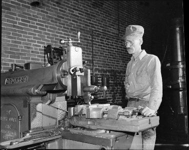 Machinist operating a lathe. The Pocahontas Corporation, Mines 33-34, Bishop, Tazewell County, Virginia. - NARA - 541076