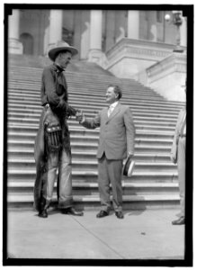 MADSEN, RALPH E. THE TALL COWBOY. AT CAPITOL, SHAKING HANDS WITH SENATOR MORRIS SHEPPARD LCCN2016870355