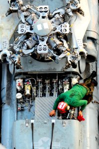 Maintenance on an SH-60F Seahawk helicopter