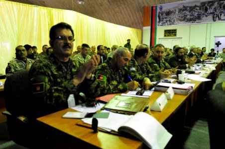 Maj. Gen. Dawran, Afghan National Air Corps Wing Squadron Commander applauds the speeches conducted at the two day quarterly Corps Commander Conference and Security Shura (4522468029)