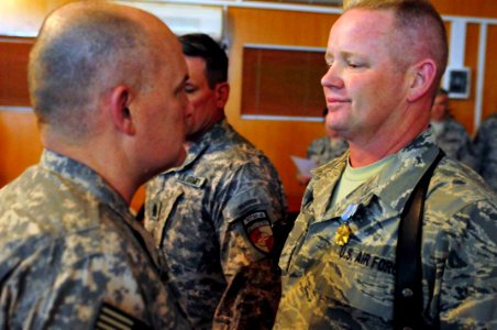 Maj. Gen. David Hogg presents a Joint Service Achievement medal to Master Sergeant John Wood (4524968675)