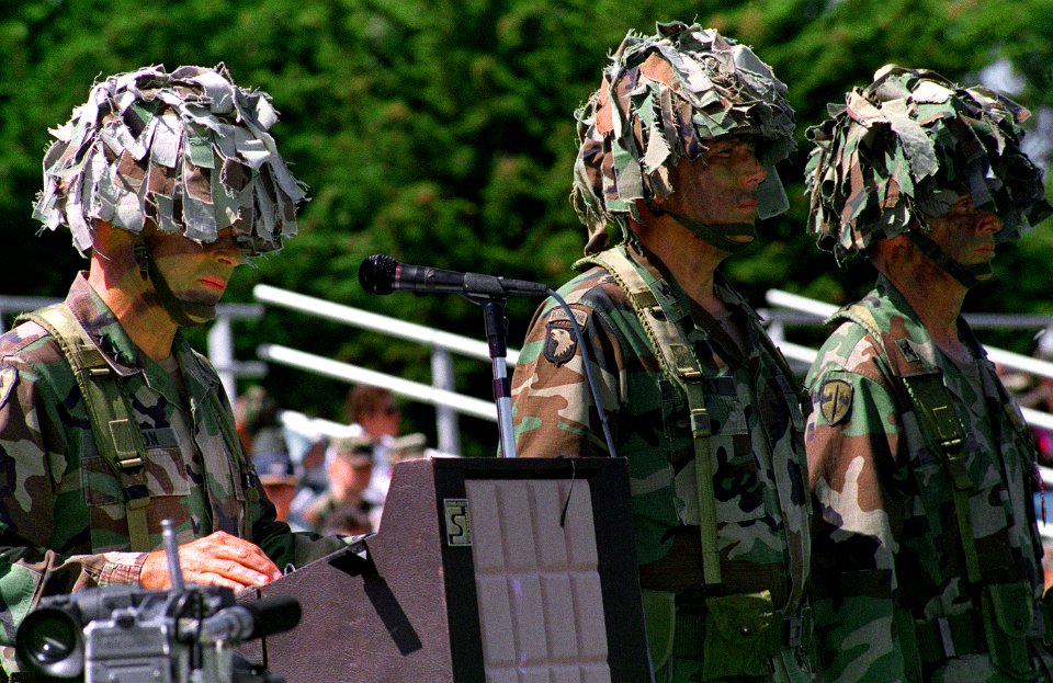 Major General Ken Simpson delivers a speech on the occasion of the division's deactivation while Colonel Ellzey and Colonel Fore observe the troops