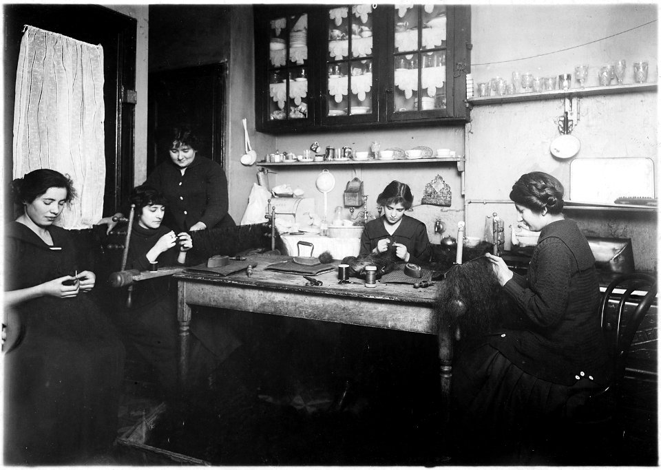 Making in the kitchen, hair goods, the partly made puffs and switches were laying around the floor. This is the home... - NARA - 523524