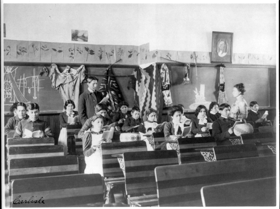 Male and female students reading in class, Carlisle Indian School, Carlisle, Pennsylvania LCCN98503023