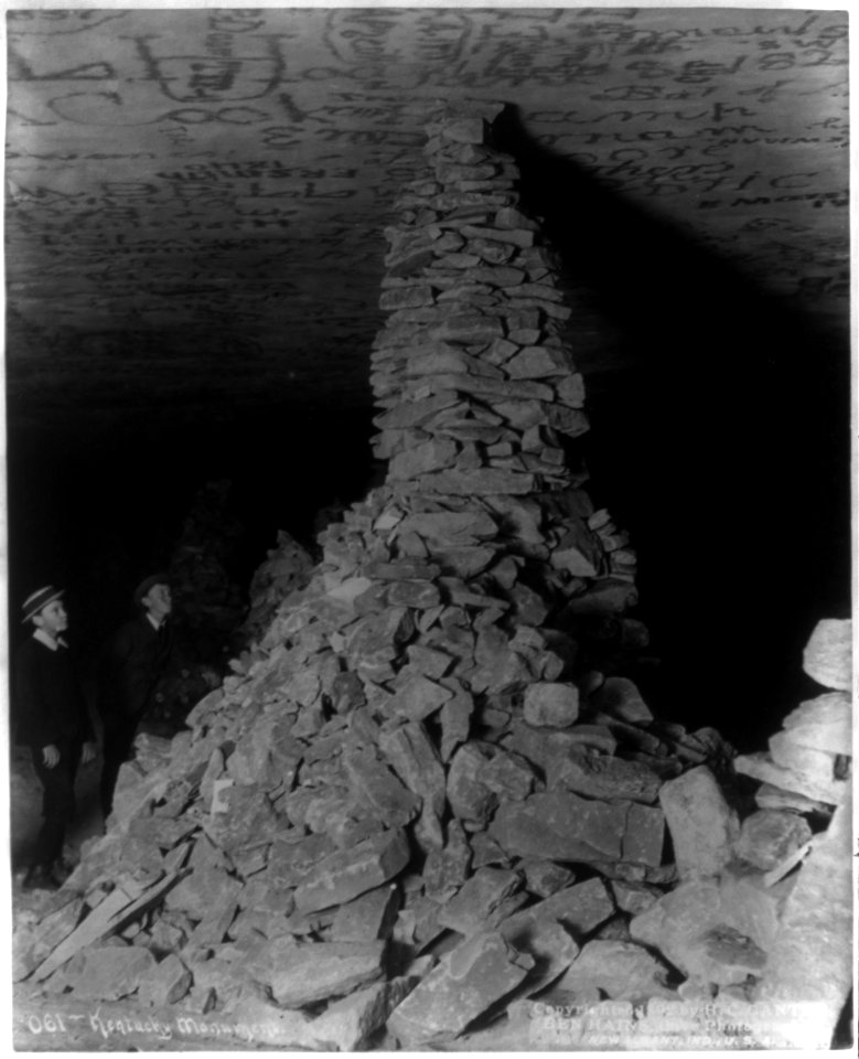 Mammoth Cave- Kentucky Monument - 2 boys looking at rocks piled to ceiling of cave LCCN2002706077