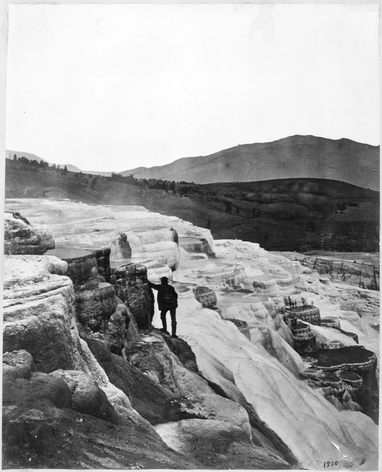 Mammoth Hot Springs, view along side of Jupiter Terrace. Thomas Moran in picture. Yellowstone. - NARA - 517643
