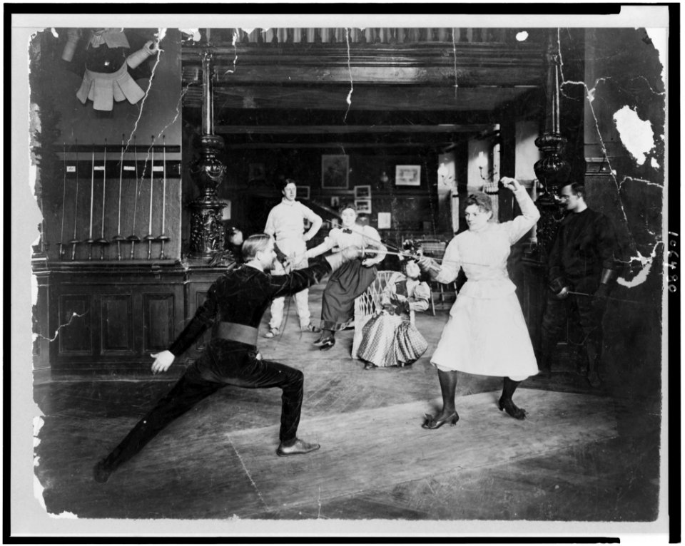 Man and woman fencing LCCN93500497