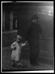 Man and a young child walking down a street, Chinatown, San Francisco LOC agc.7a55044