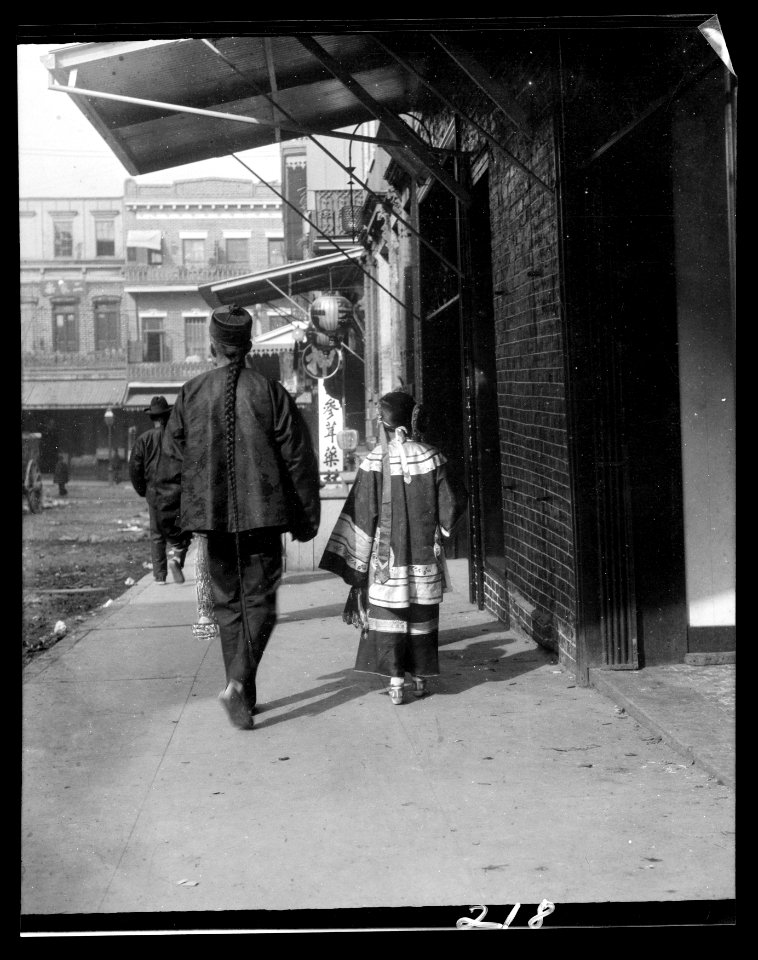 Man and a young girl walking down a sidewalk, Chinatown, San Francisco LOC agc.7a55017