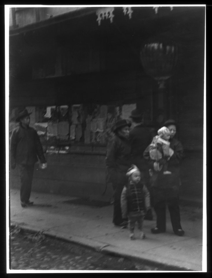 Man carrying a child accompanied by another child, Chinatown, San Francisco LOC agc.7a55081