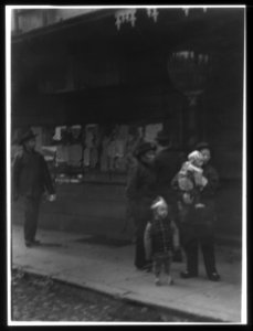 Man carrying a child accompanied by another child, Chinatown, San Francisco LOC agc.7a55081