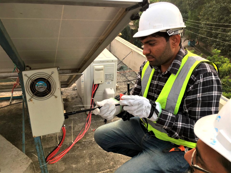 Man installating a solar panel