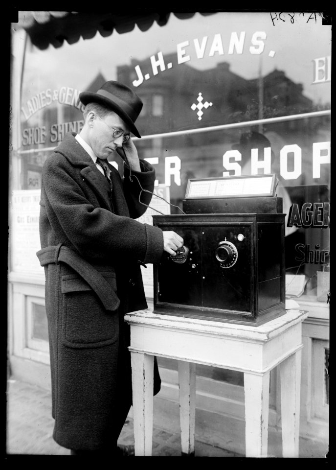 Man listening to an early radio LCCN2016887096
